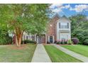 Attractive two-story townhouse with brick accents and lush landscaping, offering curb appeal at 2803 Snapfinger Manor Mnr, Decatur, GA 30035