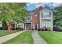 Attractive two-story townhouse with brick accents and lush landscaping, offering curb appeal at 2803 Snapfinger Manor Mnr, Decatur, GA 30035
