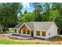 A cozy home boasts a gray roof, white siding, and a pop of color from its vibrant blue door at 38 Creek Se Dr, Cartersville, GA 30121