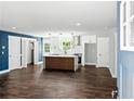 Spacious open-concept kitchen with sleek white cabinets and a stylish center island, perfect for entertaining at 38 Creek Se Dr, Cartersville, GA 30121