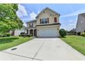Two-story home with red shutters, manicured lawn, and a long driveway at 7196 Toccoa Circle, Union City, GA 30291