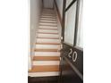 The home features a staircase with wood treads and a sleek handrail at 3541 Roswell Ne Rd # 20, Atlanta, GA 30305