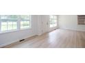 Bright and airy living room featuring large windows and gleaming floors at 2935 Catalina Dr, Decatur, GA 30032