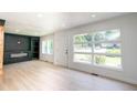 Open living room with luxury vinyl flooring and a sleek entertainment center at 2935 Catalina Dr, Decatur, GA 30032