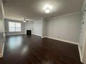 Spacious living room with hardwood floors, fireplace and ample natural light at 5535 Bright Cross Way, Suwanee, GA 30024