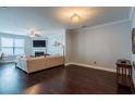 Bright living room with hardwood floors, recessed lights, and a fireplace at 5535 Bright Cross Way, Suwanee, GA 30024
