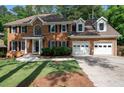 Beautiful brick home with a two-car garage and a well-maintained front yard at 1096 Polo Club Nw Dr, Marietta, GA 30064