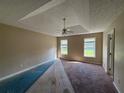 Spacious bedroom featuring carpet flooring and a ceiling fan for added comfort at 380 Paper Mill Rd, Lawrenceville, GA 30046
