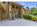 Charming front entrance with stone pillars and a gray deck welcomes you to this beautiful home at 570 Matterhorn Way, Alpharetta, GA 30022