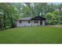 Inviting home featuring a lush green lawn, clean lines and freshly painted brick at 1733 Hollyhock Ter, Decatur, GA 30032