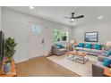 Comfortable living room with stylish furniture, modern ceiling fan, and a bright window at 1733 Hollyhock Ter, Decatur, GA 30032