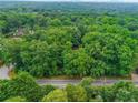 Wooded lot features abundant trees, offering a private homesite close to the city at 5680 Whitner Dr, Atlanta, GA 30327