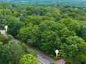 Wooded lot offers privacy with mature trees, located along a quiet road at 5680 Whitner Dr, Atlanta, GA 30327