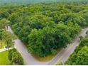 Lush, green wooded lot at the corner of two roads provides a serene setting at 5680 Whitner Dr, Atlanta, GA 30327
