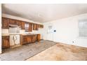 View of the kitchen featuring wood cabinets and a white door leading to the exterior at 270 Bromack Se Dr, Atlanta, GA 30315