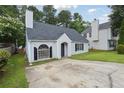 Attractive single-story home featuring a gray roof, vinyl siding, green lawn, and an asphalt driveway at 3530 Boulder Cir, Ellenwood, GA 30294