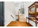 Bright entryway features hardwood floors, staircase, and decorative mirror at 2988 Rivergreen Se Ln, Atlanta, GA 30339