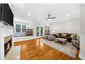 Cozy living room with fireplace, hardwood floors, and plush seating at 2988 Rivergreen Se Ln, Atlanta, GA 30339
