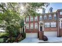 Beautiful brick townhome with a two-car garage and manicured front garden at 3351 Cumberland Club Dr # 17, Atlanta, GA 30339