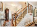 Inviting home entryway with staircase featuring wooden railings and stylish decor at 461 Mountain View Ln, Woodstock, GA 30188