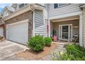 Cozy front porch and inviting doorway showcasing great curb appeal with patriotic decor and landscaping at 461 Mountain View Ln, Woodstock, GA 30188