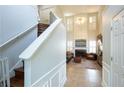 View of the spacious living room from the staircase, highlighting the high ceilings and natural light at 1312 Glenover Way, Marietta, GA 30062