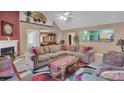 Open concept living room featuring a fireplace, vaulted ceilings, and access to dining and kitchen at 4969 Truitt Ln, Decatur, GA 30035