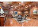 Elegant lobby featuring wood paneling, coffered ceilings, seating, and artwork at 3201 Lenox Ne Rd # 23, Atlanta, GA 30324