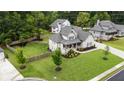 Beautiful home with a well-manicured lawn and a fenced backyard at 4395 Capstone Court, Roswell, GA 30075