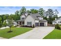 Beautiful home with a long driveway leading to an attached two-car garage at 4395 Capstone Court, Roswell, GA 30075