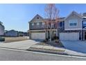 Two-story house with brick and stone accents, two car garage, and well-maintained lawn at 2639 Cooper Brook Dr, Snellville, GA 30078