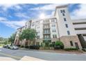 A striking exterior view of the Serrano condominium building, showcasing its architectural charm and inviting entrance at 901 Abernathy Ne Rd # 3020, Atlanta, GA 30328