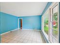 Bright living room with large windows, light tile floors, and an open layout for flexible living at 2880 Shallowford Rd, Chamblee, GA 30341