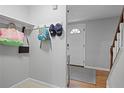 Entryway featuring a coat rack, neutral paint, and hardwood floors at 9470 Hillside Dr, Roswell, GA 30076