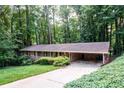 Brick ranch home with mature trees providing shade and a welcoming driveway at 2518 Foster Ridge Ne Ct, Atlanta, GA 30345