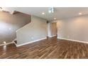 Living room featuring hardwood floors and a staircase at 620 Waynes Se Ct, Atlanta, GA 30354