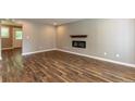 Living room featuring hardwood floors and a modern fireplace at 620 Waynes Se Ct, Atlanta, GA 30354