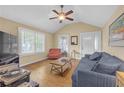 Bright living room with vaulted ceiling, wood floors, and plenty of natural light from large windows at 730 Brownwood Se Ave, Atlanta, GA 30316