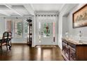 Elegant foyer with hardwood floors, decorative molding, and coffered ceilings at 3320 Pleasant Springs Dr, Cumming, GA 30028