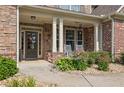 Inviting front porch with rocking chairs and lovely landscaping at 3320 Pleasant Springs Dr, Cumming, GA 30028