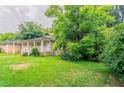 Residential property with an ample front lawn and mature trees offering shade and privacy at 3409 Hyland Dr, Decatur, GA 30032