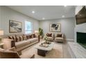 Tastefully decorated living room featuring a plush sofa, elegant chairs, and modern decor at 3409 Hyland Dr, Decatur, GA 30032