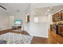 Open-concept living room with hardwood floors, and a view into the adjacent kitchen at 220 Ashley Se Ln # 19, Smyrna, GA 30080
