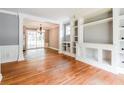 Open-concept living area featuring hardwood floors and built-in shelving at , Forest Park, GA 30297