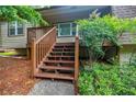 Inviting front porch with wooden stairs, offering a charming entrance to the home at 407 Doris Dr, Woodstock, GA 30188