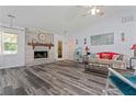 Inviting living room features wood floors, a brick fireplace, and neutral wall colors at 1738 Sherry Ln, Jonesboro, GA 30236