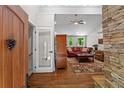 Inviting living room with hardwood floors and a cozy stone fireplace at 970 Pine Grove Pointe Dr, Roswell, GA 30075