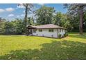 Charming home with fresh landscaping, inviting entry, and large, verdant lawn at 1769 W Austin Rd, Decatur, GA 30032