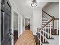 Welcoming foyer with hardwood floors, staircase, and neutral wall paint at 1373 Brawley Ne Cir, Brookhaven, GA 30319