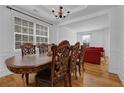 Elegant dining room featuring a large wooden table and ornate chairs, perfect for hosting gatherings and meals at 7027 Walham Grv, Duluth, GA 30097